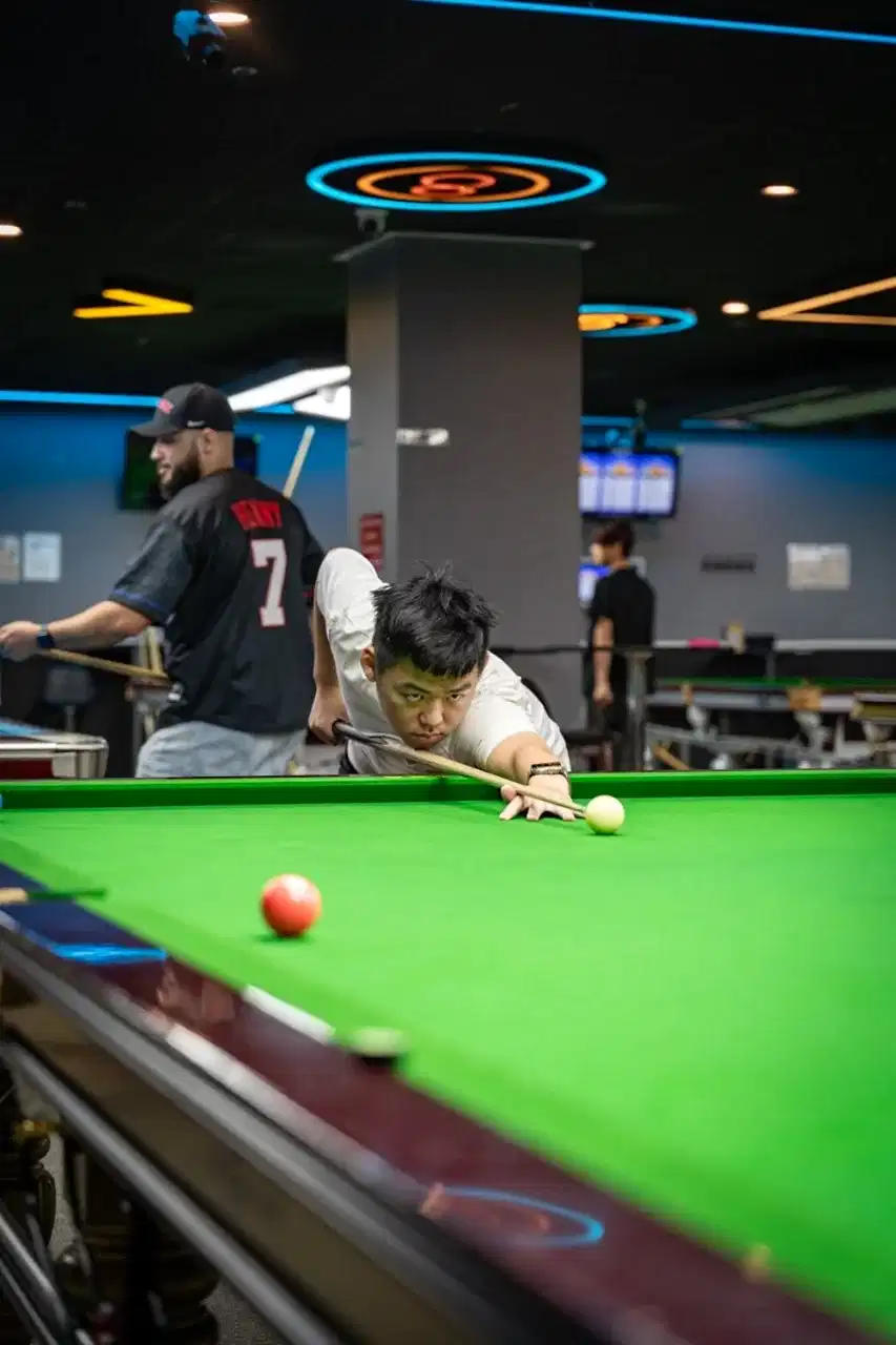 iCUE Billiard Club tournament atmosphere with premium lighting and snooker tables