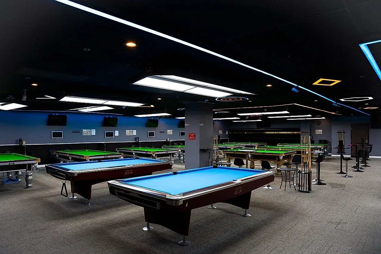 Modern billiards lounge with pool and snooker tables at iCUE Billiard Club in Rowland Heights